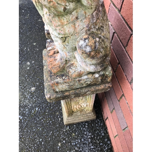 21 - PAIR OF TERRACOTTA STONE LIONS ON PLINTHS