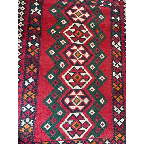 240 - RUG APPROX 136CM X 234CM