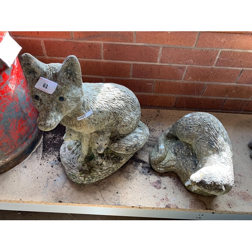 61 - COMPOSITE STONE FOXES