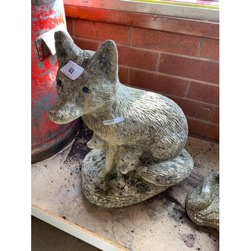 61 - COMPOSITE STONE FOXES