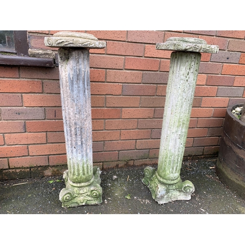 74 - PAIR OF COMPOSITE STONE PEDESTALS