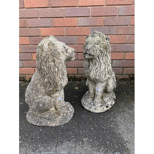 76 - PAIR OF COMPOSITE STONE LIONS