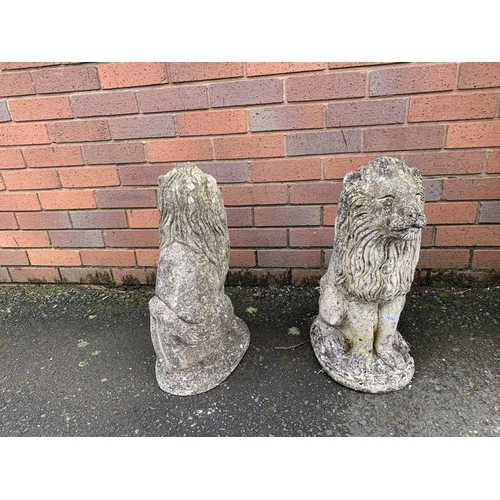 76 - PAIR OF COMPOSITE STONE LIONS