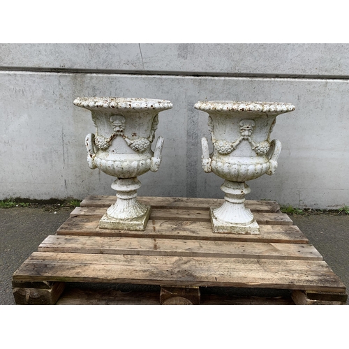 77 - PAIR OF CAST IRON URNS