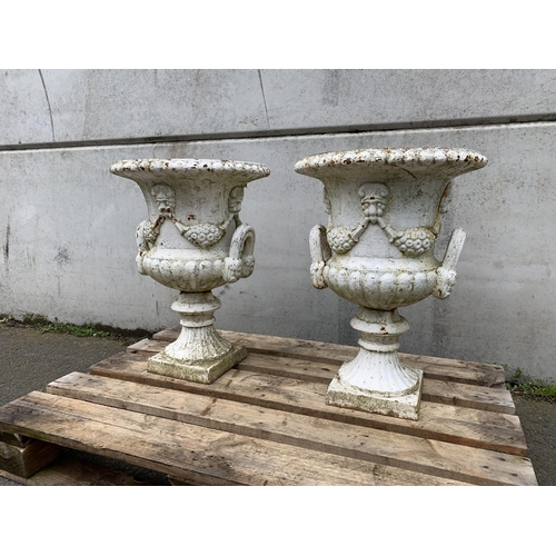 77 - PAIR OF CAST IRON URNS