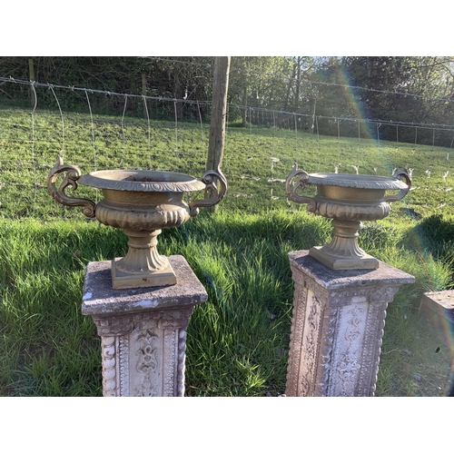 37 - PAIR OF CAST URNS ON PEDESTALS