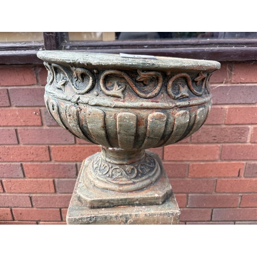 15 - TERRACOTTA URN ON PLINTH