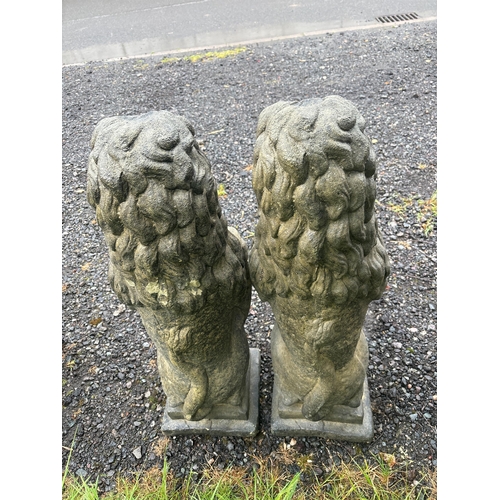 46 - PAIR OF COMPOSITE STONE LIONS