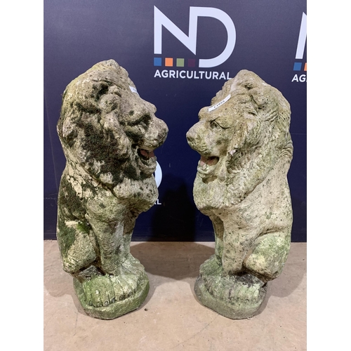 69 - PAIR COMPOSITE STONE LIONS