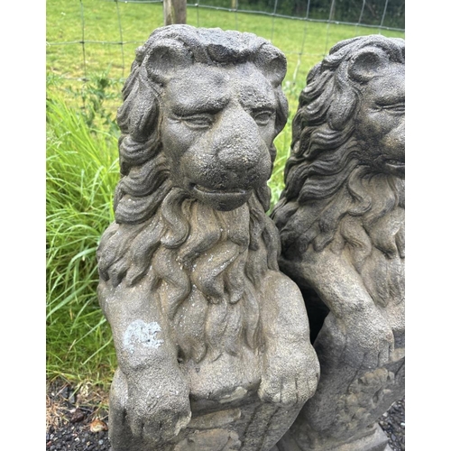 44 - PAIR OF COMPOSITE STONE LIONS