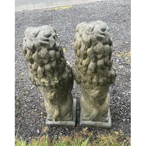 44 - PAIR OF COMPOSITE STONE LIONS