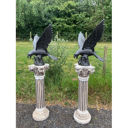 111 - PAIR OF CAST EAGLES ON PEDESTALS