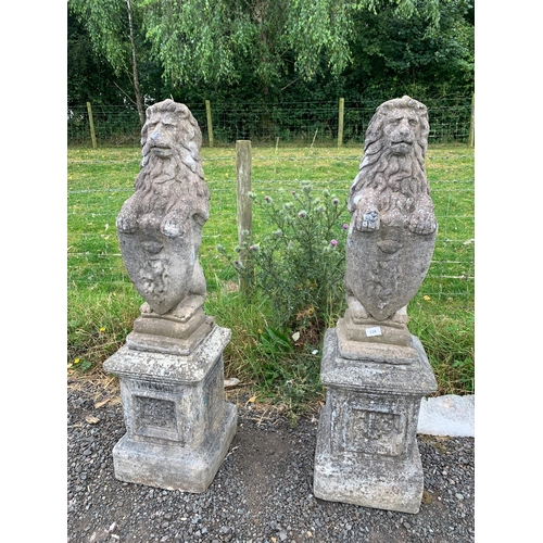 114 - PAIR OF COMPOSITE STONE LIONS