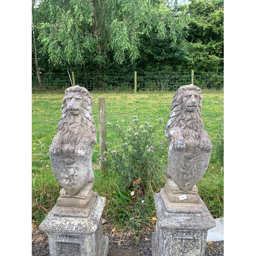 114 - PAIR OF COMPOSITE STONE LIONS