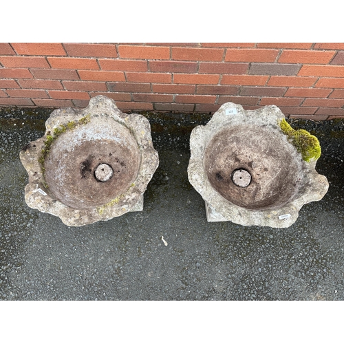 125 - PAIR OF COMPOSITE STONE URNS