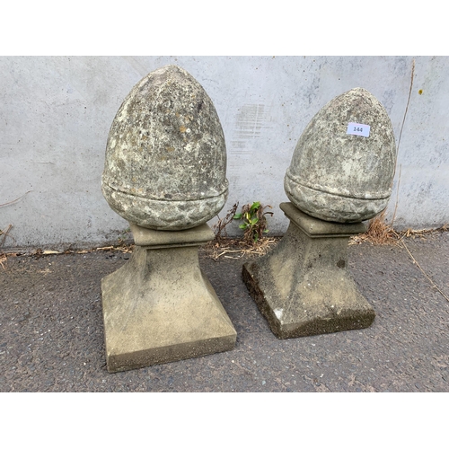 144 - PAIR OF COMPOSITE STONE FINIALS