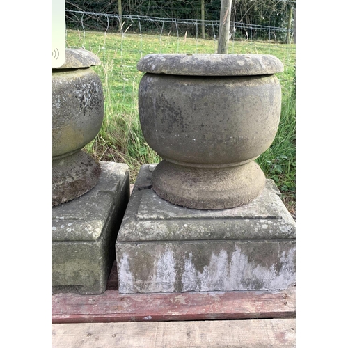 26 - EARLY CARVED STONE URNS