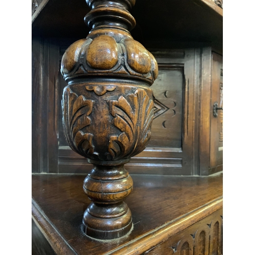 247 - HEAVILY CARVED COURT CUPBOARD