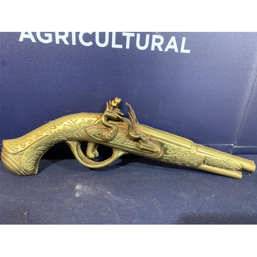 395 - BRASS PISTOL DECORATION