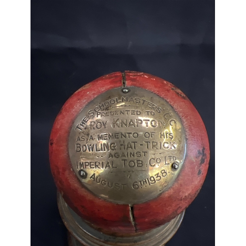 168 - 1938 CRICKET BALL ON STAND