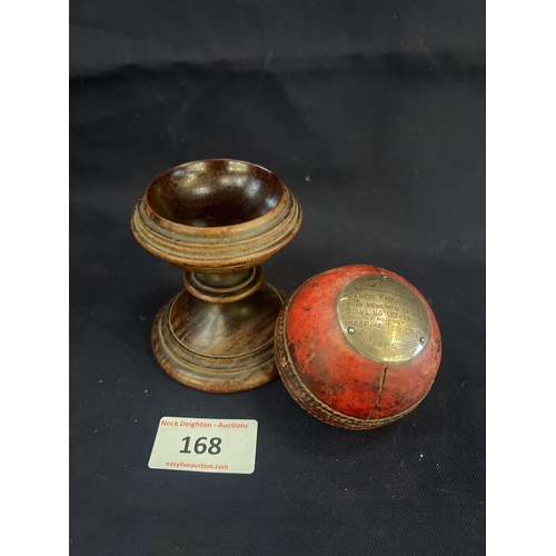 168 - 1938 CRICKET BALL ON STAND