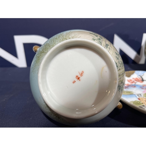 329 - ORIENTAL CUP & SAUCER WITH FOREST SCENE