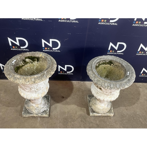 41 - PAIR OF COMPOSITE STONE URNS