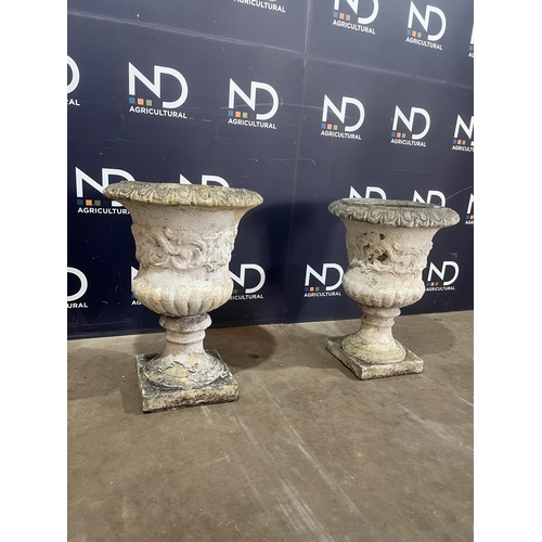 41 - PAIR OF COMPOSITE STONE URNS