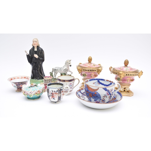 284 - A quantity of English ceramics, including a Staffordshire hollow cast figure of Reverend John Wesley... 