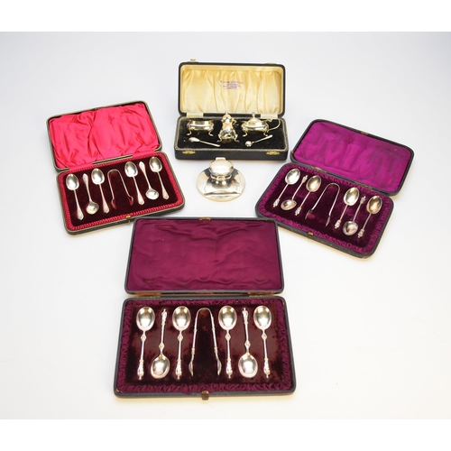 31 - A small collection of silver, comprising; a cased set of six silver apostle teaspoons with a pair of... 