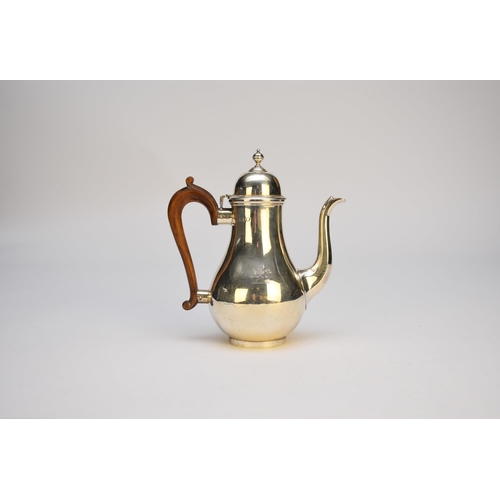 34 - An Edwardian silver coffee pot, Charles Stuart Harris, London 1904, of baluster form with turned woo... 