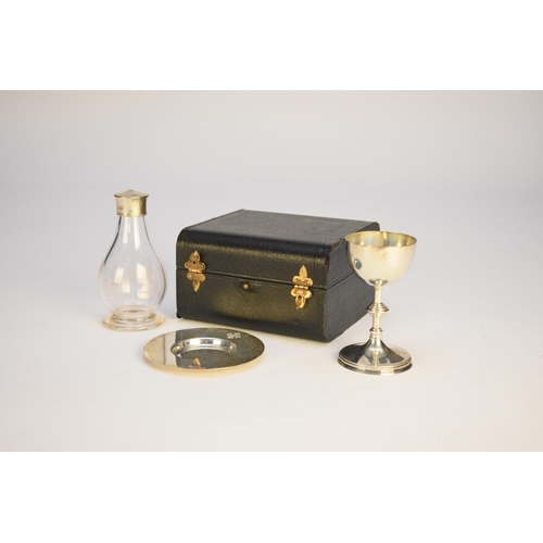 35 - A cased silver travelling communion set, J Wippell & Co Ltd, London 1926, comprising; a patten, a ch... 