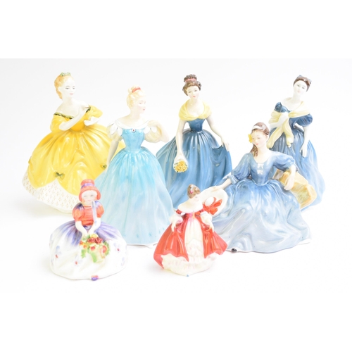 353 - A group of Royal Doulton figures comprising 'Lynne', HN2329, 'Sunday Best', HN2206, 'Goody Two Shoes... 