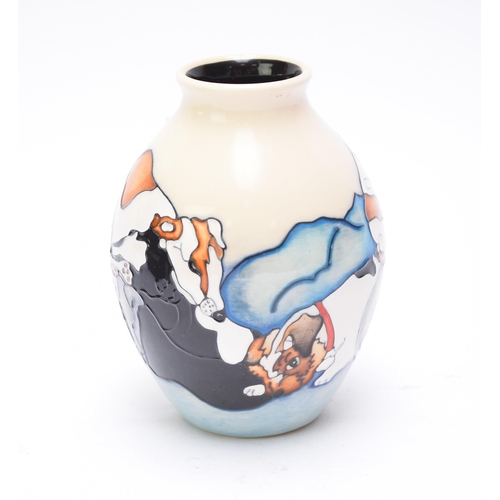 358 - A Moorcroft vase designed by Kerry Goodwin, date mark indistinct, possibly 2011, decorated with dogs... 