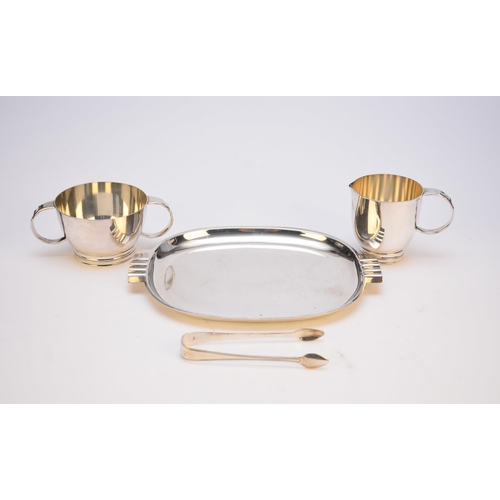 40 - An Art Deco silver plated tray, 27cm wide, with accompanying cream jug and sugar bowl, each piece st... 