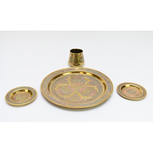 498 - A collection of Cairo type Islamic brassware, with copper and silver inlay, including three boxes, t... 