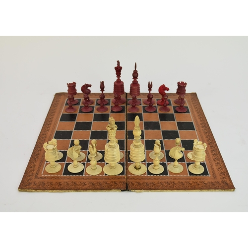 504 - An English carved bone chess set, late 19th century, 32 pieces, one set stained red, kings 10.4cm hi... 