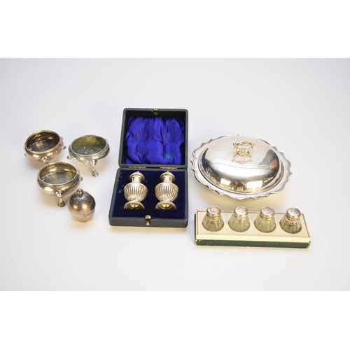 51 - A collection of silver cruets, comprising; a cased pair of pepper pots, Chester 1908, three cauldron... 