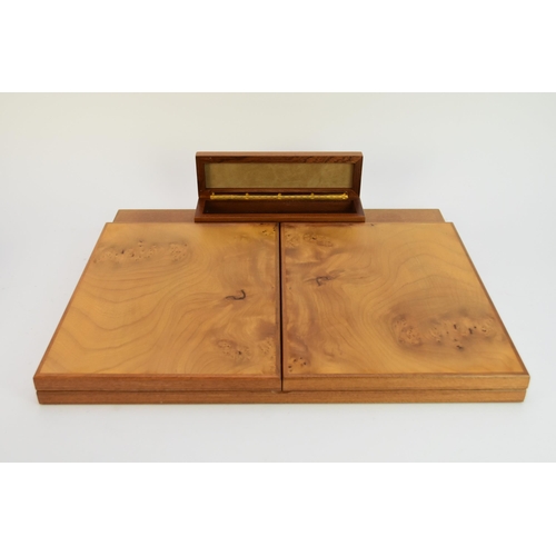 512 - An Agresti burr walnut desk stand, with pen box and bi-fold folio opening to a fitted interior with ... 