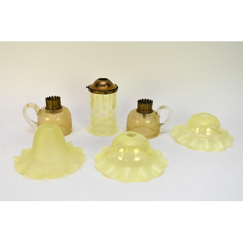 538 - A collection of Victorian and later glass lamp shades, mostly Vaseline glass, together with two post... 