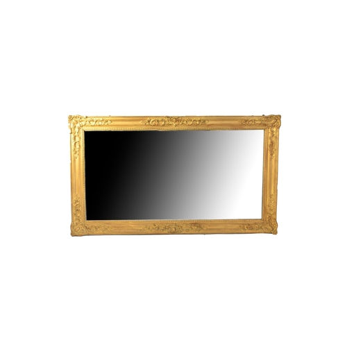 577 - A late 19th century giltwood and gesso overmantel mirror, 163cm wide x 95cm high.