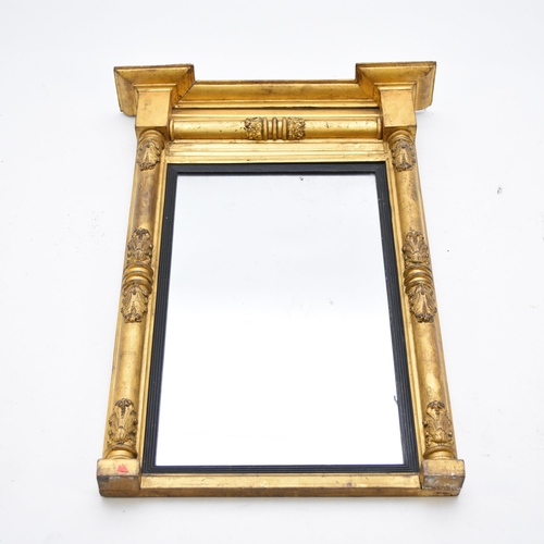 580 - A William IV gilt gesso pier mirror, with ebonised reeded slip, 58.5cm wide x 86cm high.