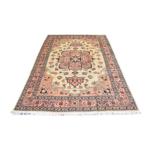 581 - A Heriz rug, North West Persia, 290cm x 195cm