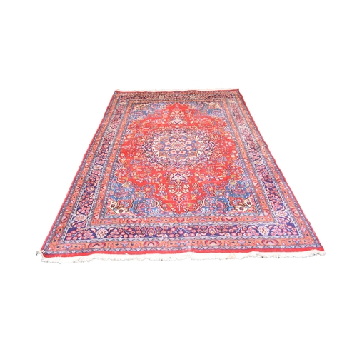 584 - A Mashad pattern rug, 292cm x 194cm.