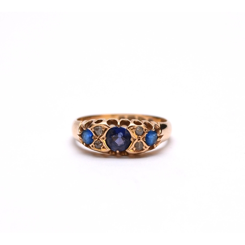 64 - A Victorian 18ct gold seven stone sapphire, diamond and blue paste ring, hallmarked Chester 1894, de... 