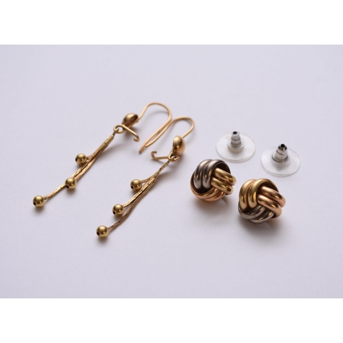 91 - A pair of 18ct tri-coloured gold stylised knot earrings, with post fittings, weight approx 4.4g, tog... 