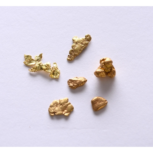 101 - A collection of five gold nuggets, together with a yellow metal fragment, total weight approx 6g (6)