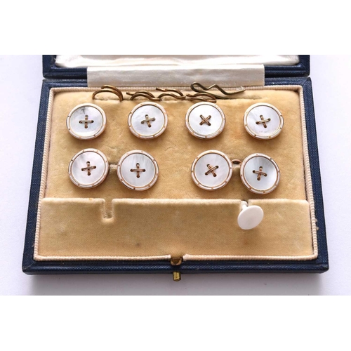 109 - A cased set of enamel and mother of pearl cufflinks and studs, comprising; a pair of cufflinks and f... 