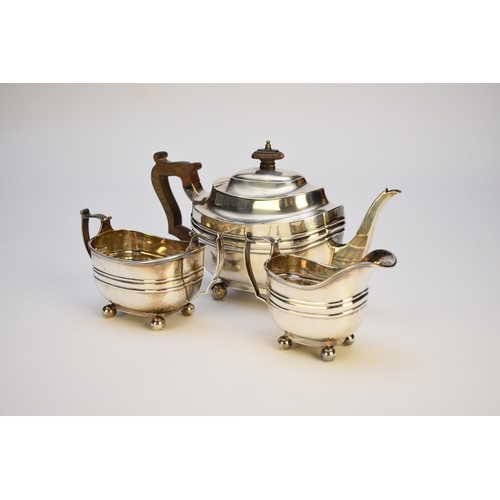 11 - An Edwardian three piece silver tea service, Thomas Bradbury & Sons, London 1905 & 1906, each of ova... 