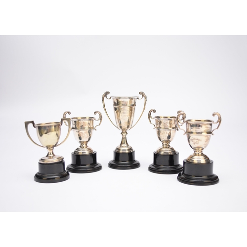 20 - Three small silver two handled trophy cups, Mappin & Webb, Sheffield 1925, each with stand, 7.5cm hi... 